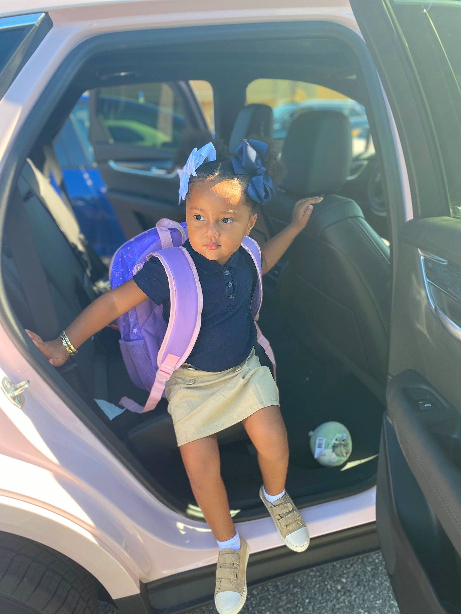 Zariyah joined the competition — help win amazing prizes! alloy_wheel, auto_part, automotive_design, automotive_exterior, automotive_lighting, automotive_tire, bumper, car, door, electric_blue, hood, mode_of_transport, motor_vehicle, person, personal_luxury_car, rim, shoe, toddler, vehicle, vehicle_door