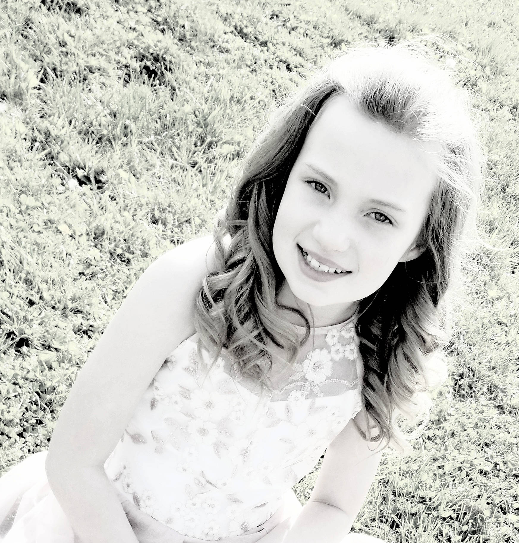 Isabella is registered to the contest to win money with this photo: black_and_white, black_hair, cool, eyebrow, face, flash_photography, fun, gesture, grass, grass_family, happy, iris, joy, lip, long_hair, people_in_nature, person, skin, smile, standing