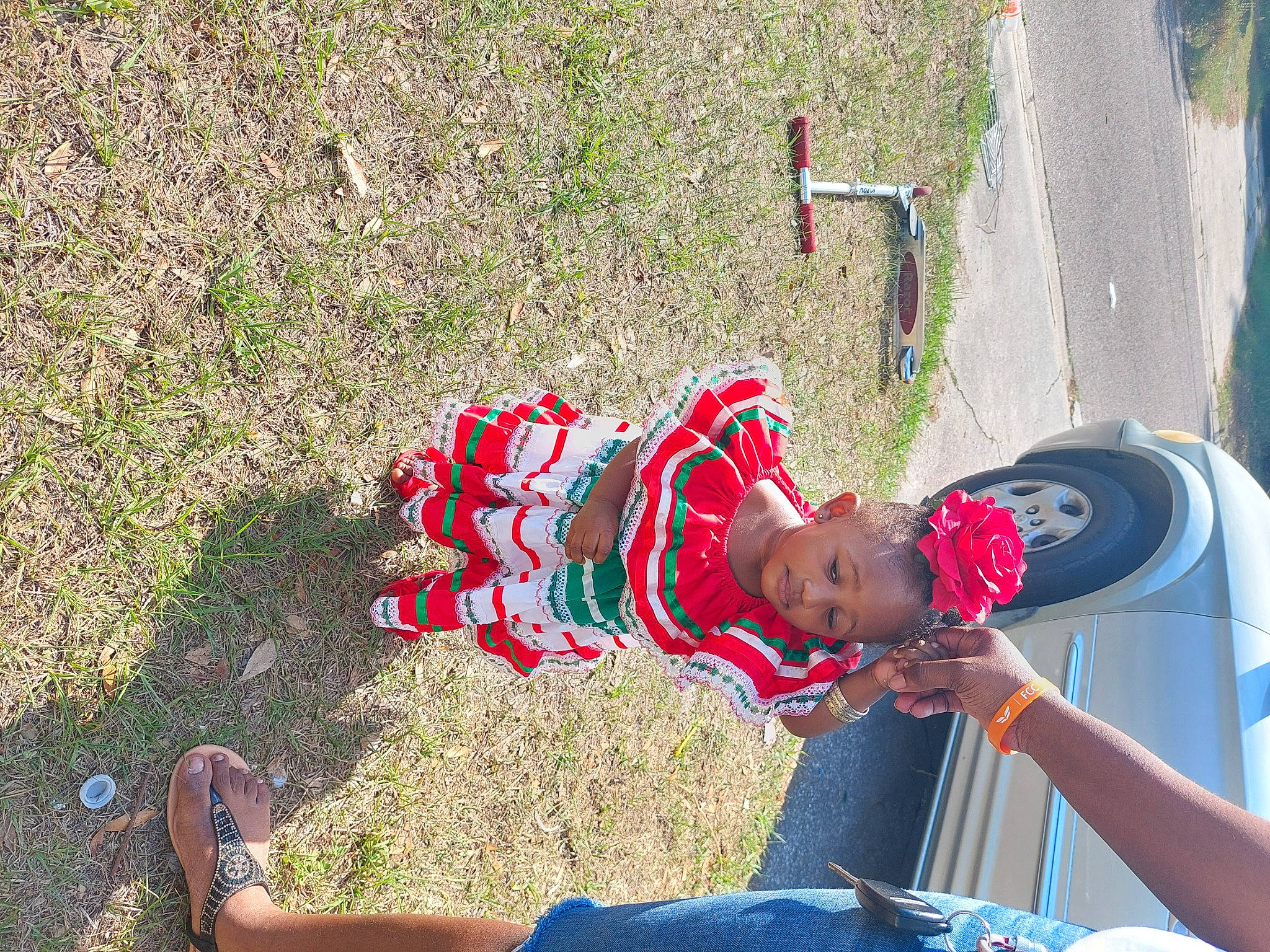 Ivory joined the competition — help win amazing prizes! automotive_tire, baby, car, carmine, foot, fun, grass, hat, leisure, people_in_nature, person, plant, recreation, red, sandal, tire, toddler, toy, tree, vehicle_door