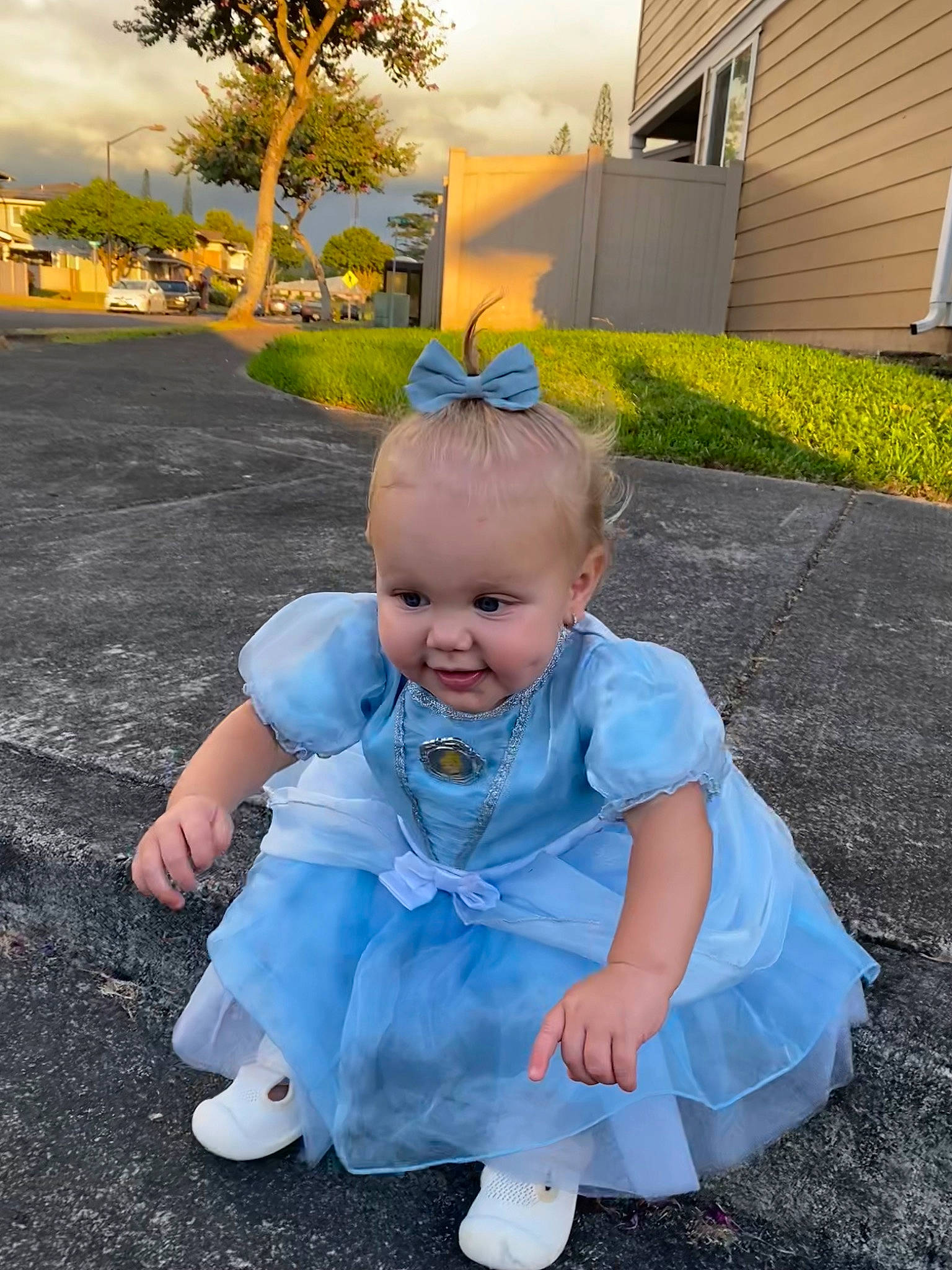 Iris is registered to the contest to win money with this photo: baby, baby_toddler_clothing, child, electric_blue, fun, garden, grass, happy, leisure, people_in_nature, person, plant, recreation, sandal, sitting, smile, toddler, tree, vacation, yard