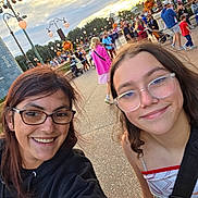 Tabatha Glover is registered to the contest to win money with this photo: selfie, outdoor, crowd, people, glasses, smile, festival, decoration, tree, street, lamp_post, woman, child, casual_clothing, daytime, happy, event, urban, fun, portrait