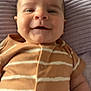 Jaxon is registered to the contest to win money with this photo: baby, infant, smiling, face, clothing, onesie, striped, blanket, textured, lying_down, happy, cute, child, skin, head, arm, closeup, portrait, person, soft