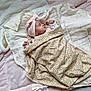 baby, bed, bedroom, blanket, bonnet, clothing, cushion, face, furniture, hat, head, homedecor, indoors, newborn, person, photography, portrait, quilt, room, sleeping