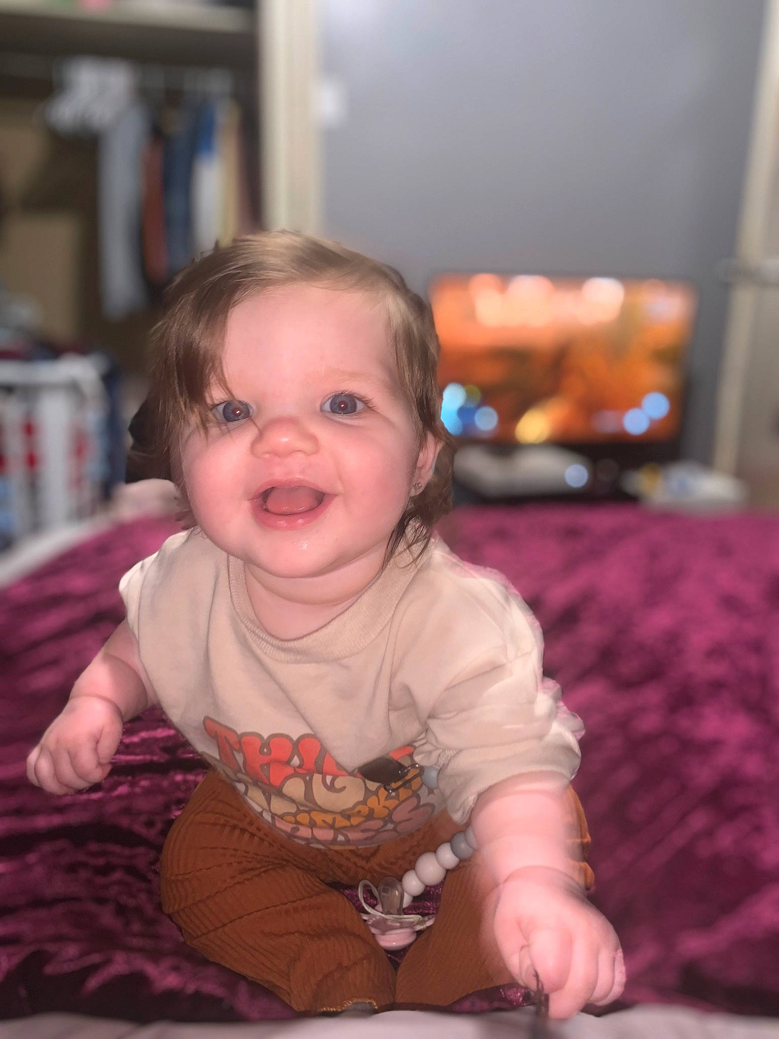 Charlie is registered to the contest to win money with this photo: baby, baby_toddler_clothing, cheek, child, dress, eye, flooring, fun, happy, head, human, iris, mammal, person, pink, skin, sleeve, smile, t_shirt, toddler