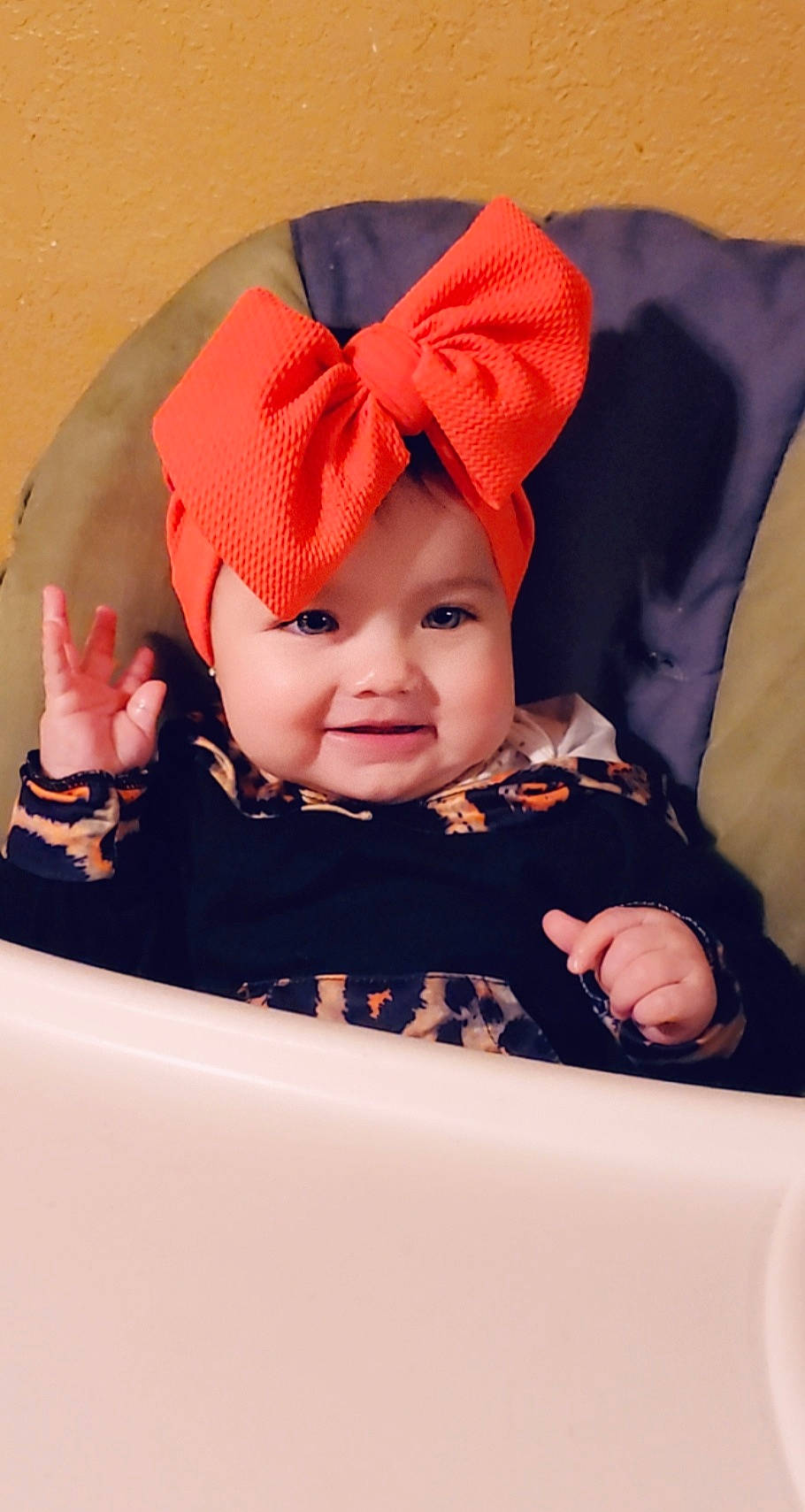 Kendra is registered to the contest to win money with this photo: baby, baby_laughing, baby_products, baby_safety, baby_toddler_clothing, bonnet, child, costume_accessory, headgear, headwear, joy, person, toddler, wool