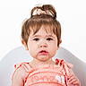 Noelle is registered to the contest to win money with this photo: toddler, child, portrait, face, young, sitting, indoors, studio, pink_outfit, dress, hair_bow, ponytail, brown_hair, baby, looking_at_camera, serious_expression, chair, white_background, closeup, photography