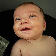 Grayson is registered to the contest to win money with this photo: baby, infant, smile, face, blue_eyes, cheeks, skin, portrait, closeup, happy, looking_up, bare_shoulders, child, cute, expression, human, person, newborn, indoors, head