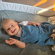 Austin joined the competition — help win amazing prizes! baby, blanket, child, clothing, comfort, cushion, cute, denim_overalls, face, hand, happy, indoor, infant, light, mesh, playpen, portrait, smile, soft, white_shirt