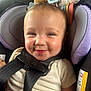 Violet joined the competition — help win amazing prizes! baby, car_seat, smile, child, infant, seatbelt, toy, comfort, happy, cute, clothing, face, head, safety, child_seat, indoors, closeup, person, young_child, seat