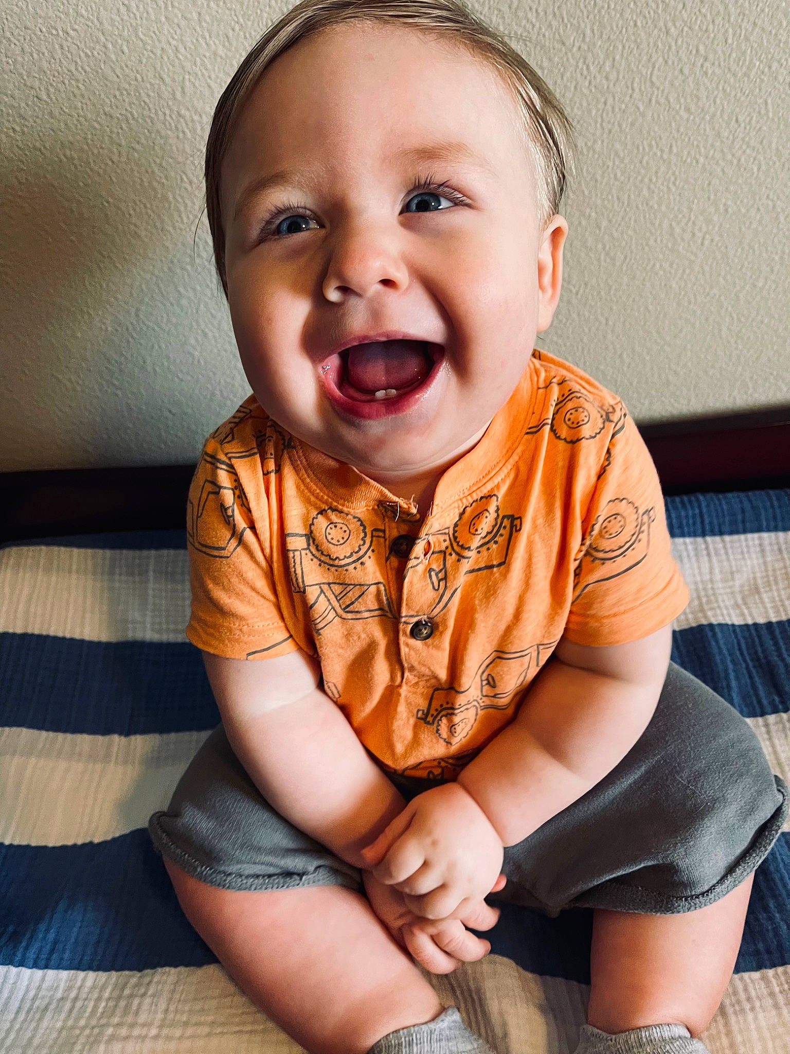 Waylon is registered to the contest to win money with this photo: baby, baby_toddler_clothing, cheek, child, comfort, flash_photography, flooring, happy, head, knee, neck, nose, orange, person, skin, sleeve, smile, t_shirt, thigh, toddler
