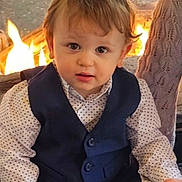 Rowan joined the competition — help win amazing prizes! child, toddler, baby, face, eyes, hair, vest, polka_dot_shirt, formal_wear, fireplace, fire, flames, indoor, portrait, sitting, cute, hands, cheeks, lap, clothing