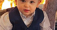 Rowan joined the competition — help win amazing prizes! baby, cheeks, child, clothing, cute, eyes, face, fire, fireplace, flames, formal_wear, hair, hands, indoor, lap, polka_dot_shirt, portrait, sitting, toddler, vest