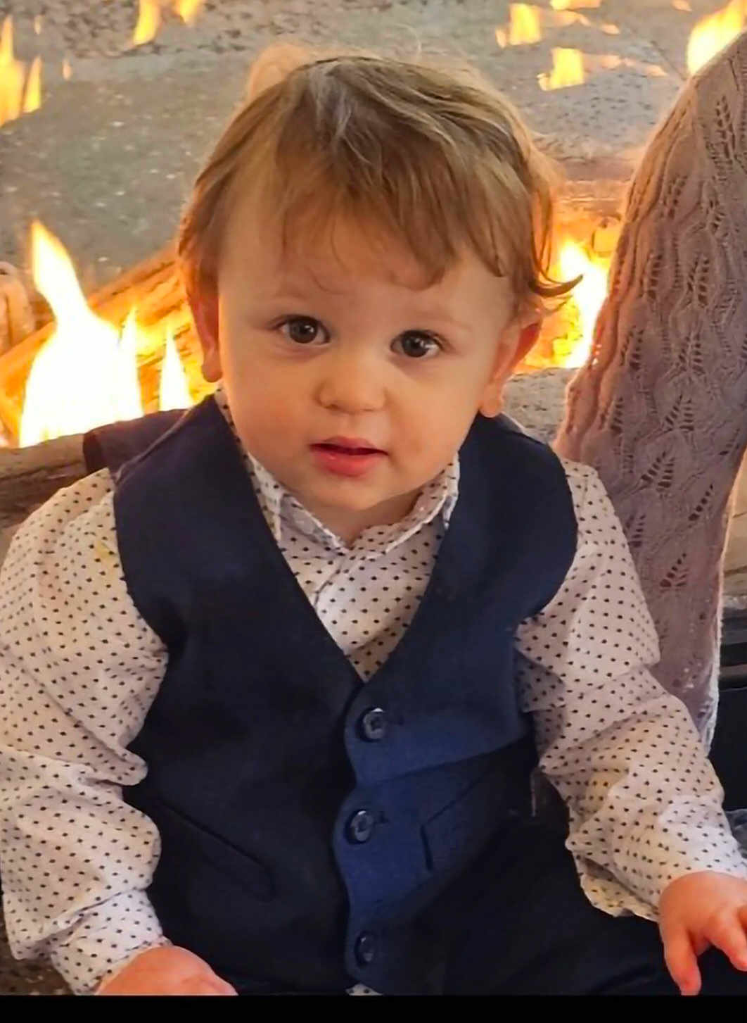 Rowan joined the competition — help win amazing prizes! child, toddler, baby, face, eyes, hair, vest, polka_dot_shirt, formal_wear, fireplace, fire, flames, indoor, portrait, sitting, cute, hands, cheeks, lap, clothing