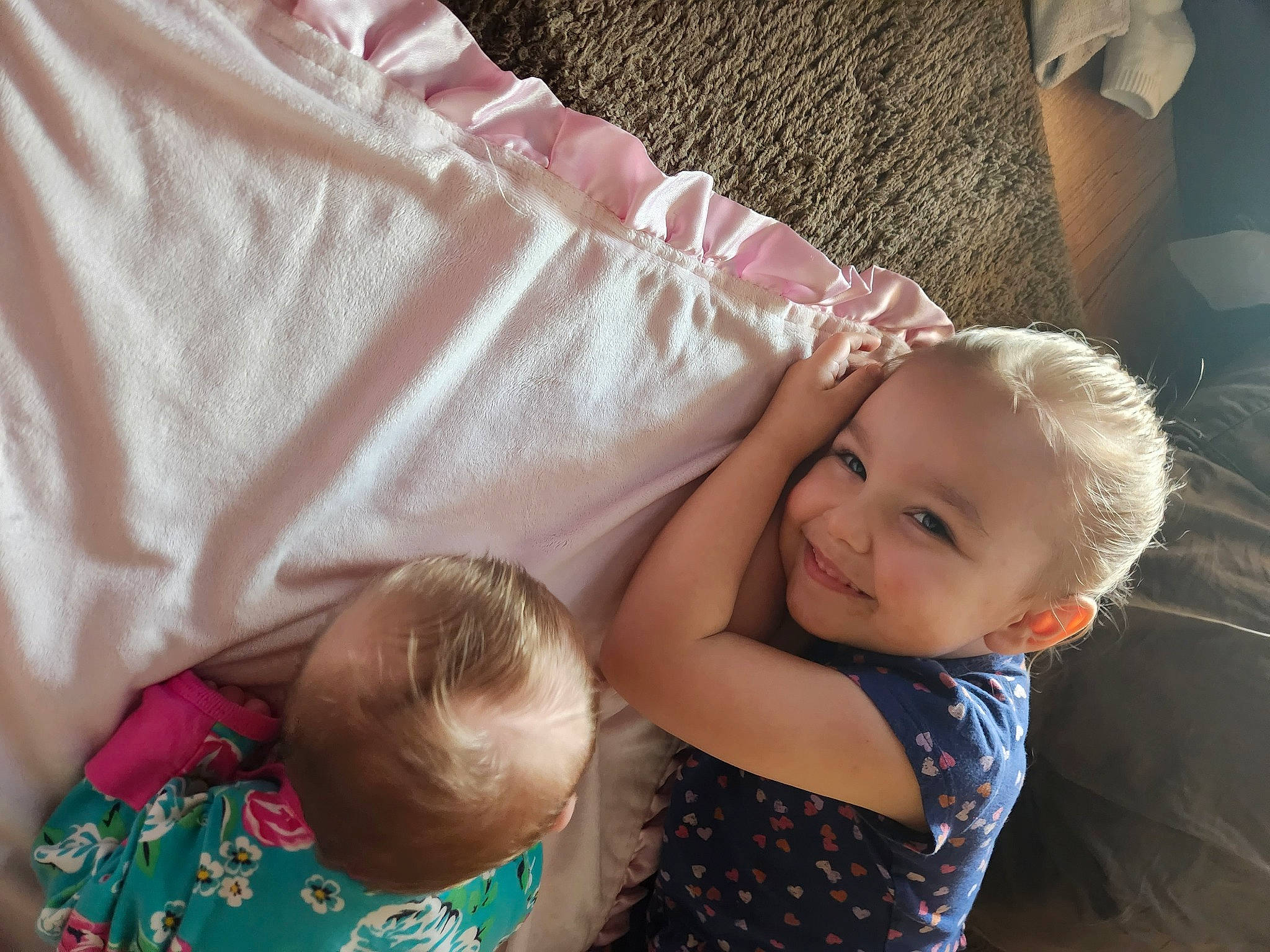 Lilith is registered to the contest to win money with this photo: arm, baby, baby_toddler_clothing, cheek, child, comfort, couch, finger, fun, gesture, grass, hair, happy, head, joy, pattern, person, sitting, skin, smile