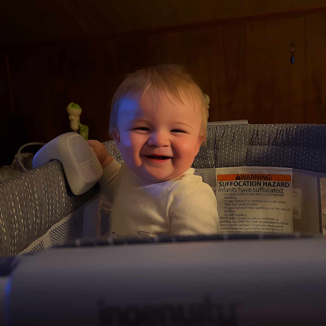 Easton joined the competition — help win amazing prizes! baby, babylaughing, bed, bodypart, computer, crib, electronics, face, finger, furniture, hand, happy, head, infantbed, laptop, laughing, pc, person, photography, smile