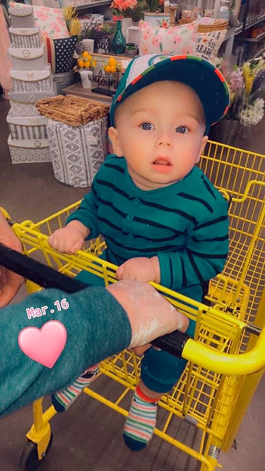 Konnor joined the competition — help win amazing prizes! baby, baby_products, baby_toddler_clothing, cap, cart, chair, cheek, child, fun, headwear, lap, leisure, person, photograph, play, shopping_cart, sitting, skin, snapshot, surprise