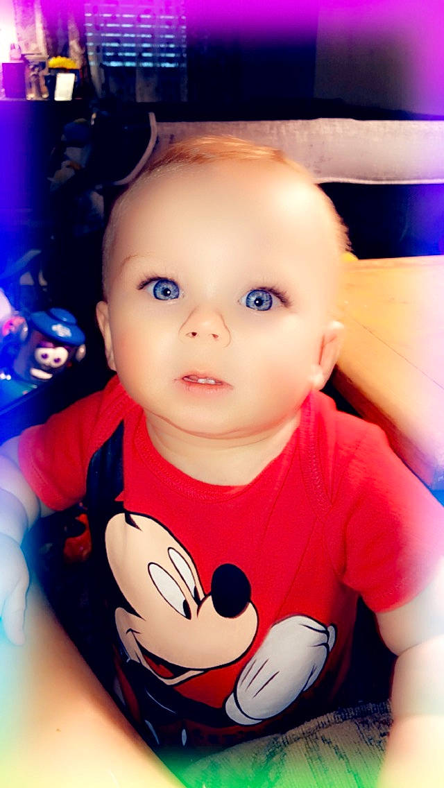 Konnor is registered to the contest to win money with this photo: arm, baby, baby_toddler_clothing, blue, cheek, cool, eyelash, facial_expression, flash_photography, happy, human, iris, mouth, nose, person, product, skin, sleeve, t_shirt, toddler