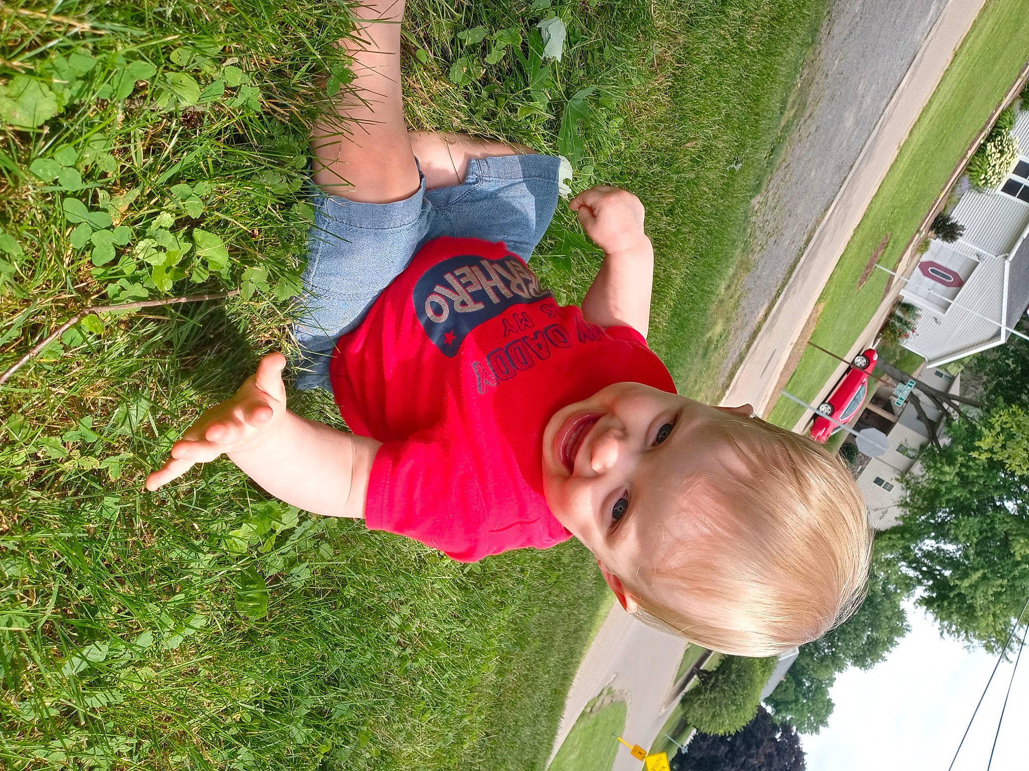 Ricky is registered to the contest to win money with this photo: arm, car, child, elbow, fun, grass, green, happy, hat, joy, leaf, leisure, people_in_nature, person, plant, recreation, shorts, smile, summer, t_shirt