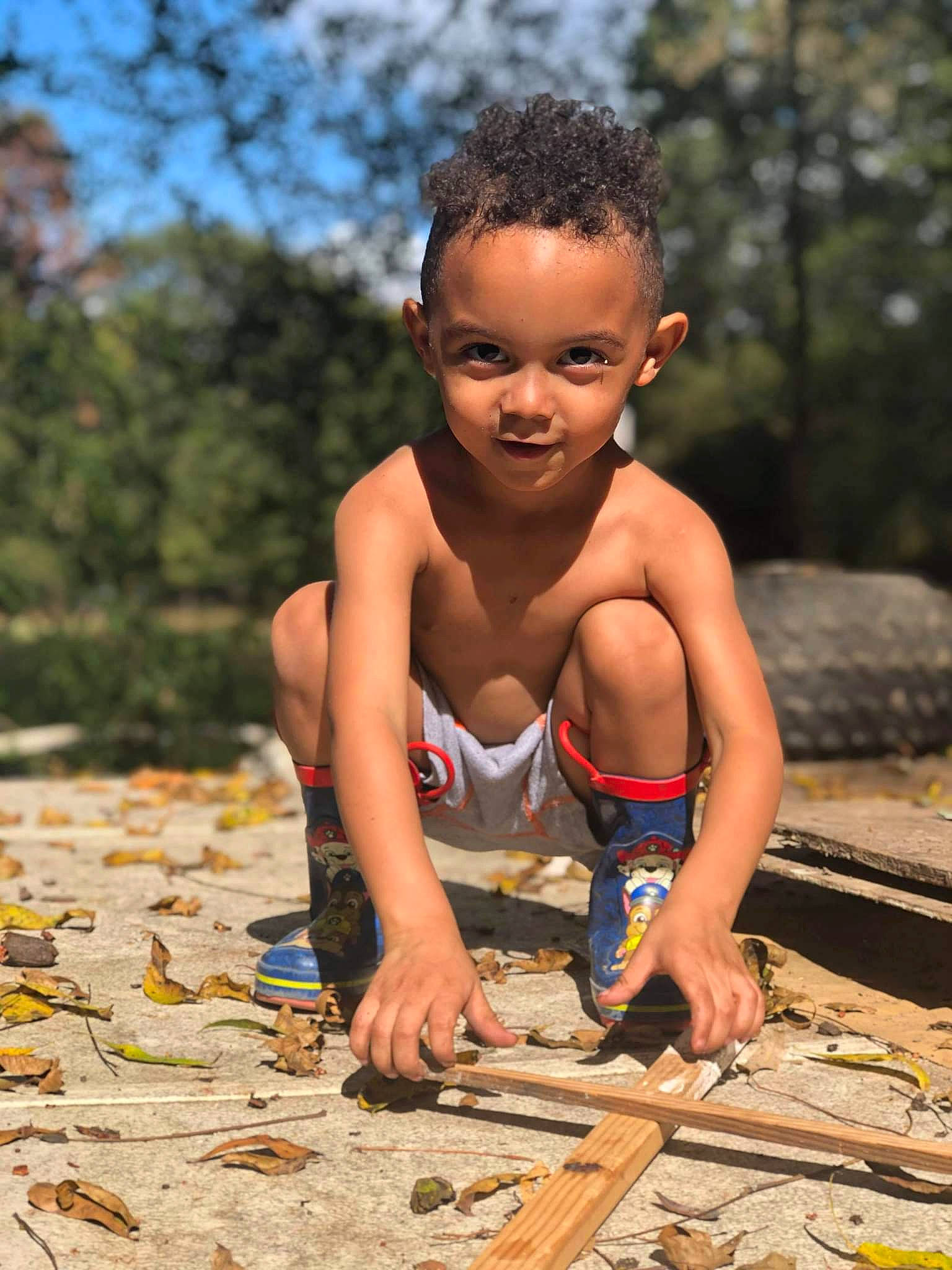 Kaydinn is registered to the contest to win money with this photo: adaptation, barechested, beauty, chest, child, flash_photography, flooring, fun, happy, joy, leisure, people, people_in_nature, person, play, recreation, sitting, smile, soil, toddler