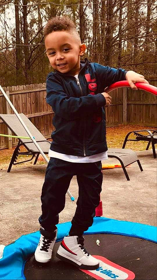 Kaydinn joined the competition — help win amazing prizes! balance, chair, child, electric_blue, fun, grass, happy, human, joy, leisure, outdoor_play_equipment, people_in_nature, person, play, recreation, sitting, smile, sneakers, sweatpant, toddler