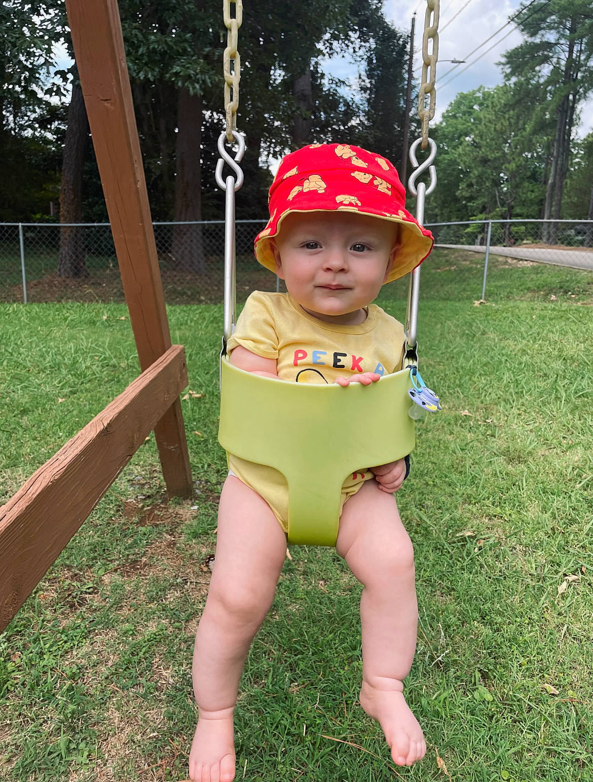 Harris joined the competition — help win amazing prizes! baby, baby_toddler_clothing, baseball_cap, cap, child, fun, grass, happy, hat, headwear, leisure, outdoor_play_equipment, people_in_nature, person, plant, play, playground, recreation, sky, swing
