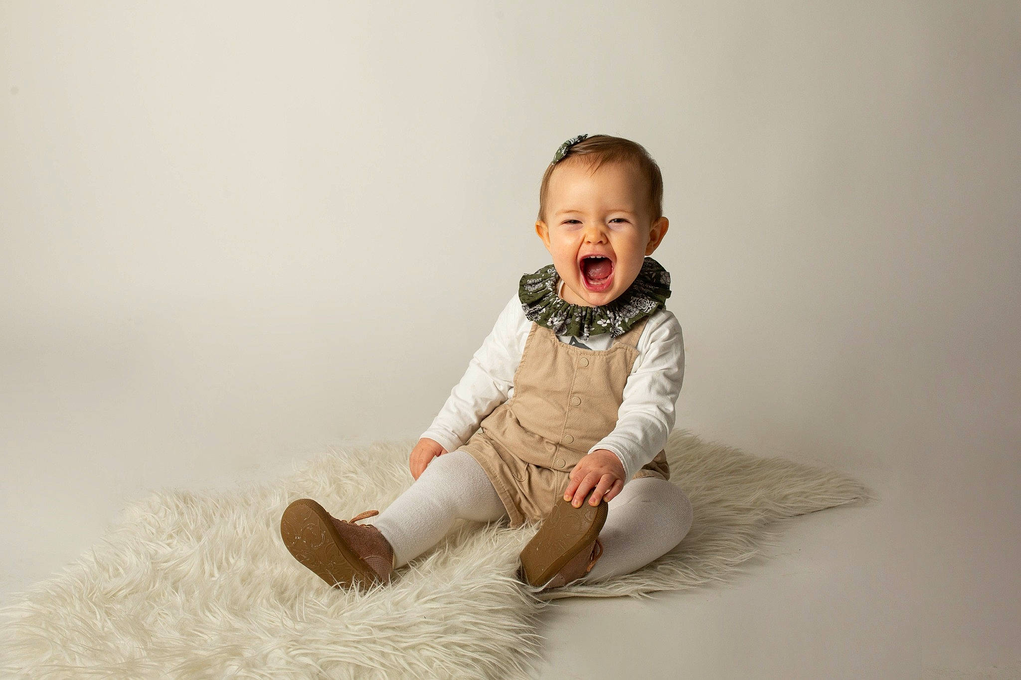 Joy participe au concours pour gagner de l'argent avec cette photo : arm, art, baby, baby_toddler_clothing, collar, comfort, flash_photography, flooring, fur, grass, happy, human_body, human_leg, iris, people_in_nature, person, sitting, sleeve, smile, toddler