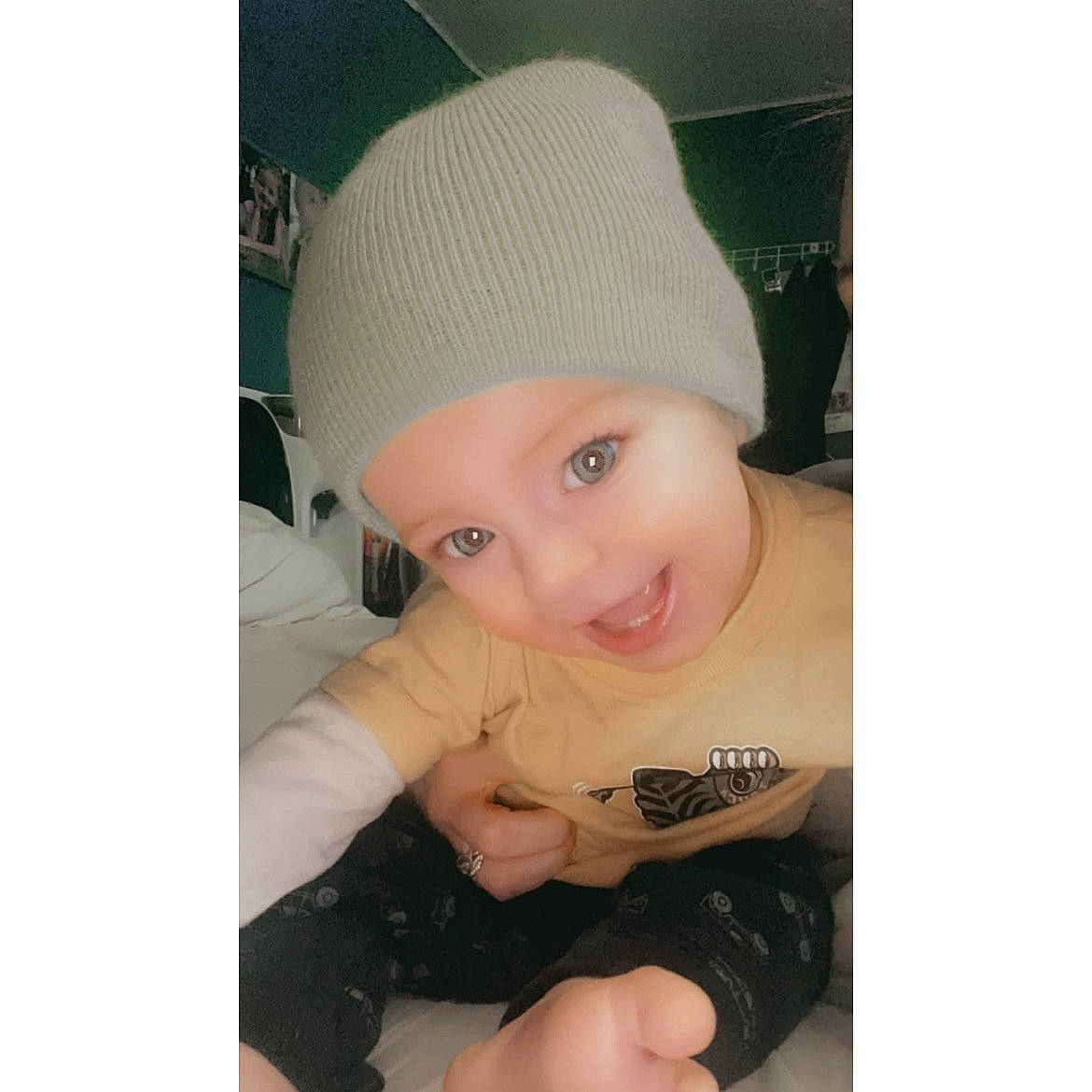 Miles joined the competition — help win amazing prizes! baby, baby_toddler_clothing, baseball_cap, beanie, cap, child, fashion_accessory, font, happy, head, headgear, headwear, helmet, knit_cap, neck, pattern, person, sleeve, smile, t_shirt