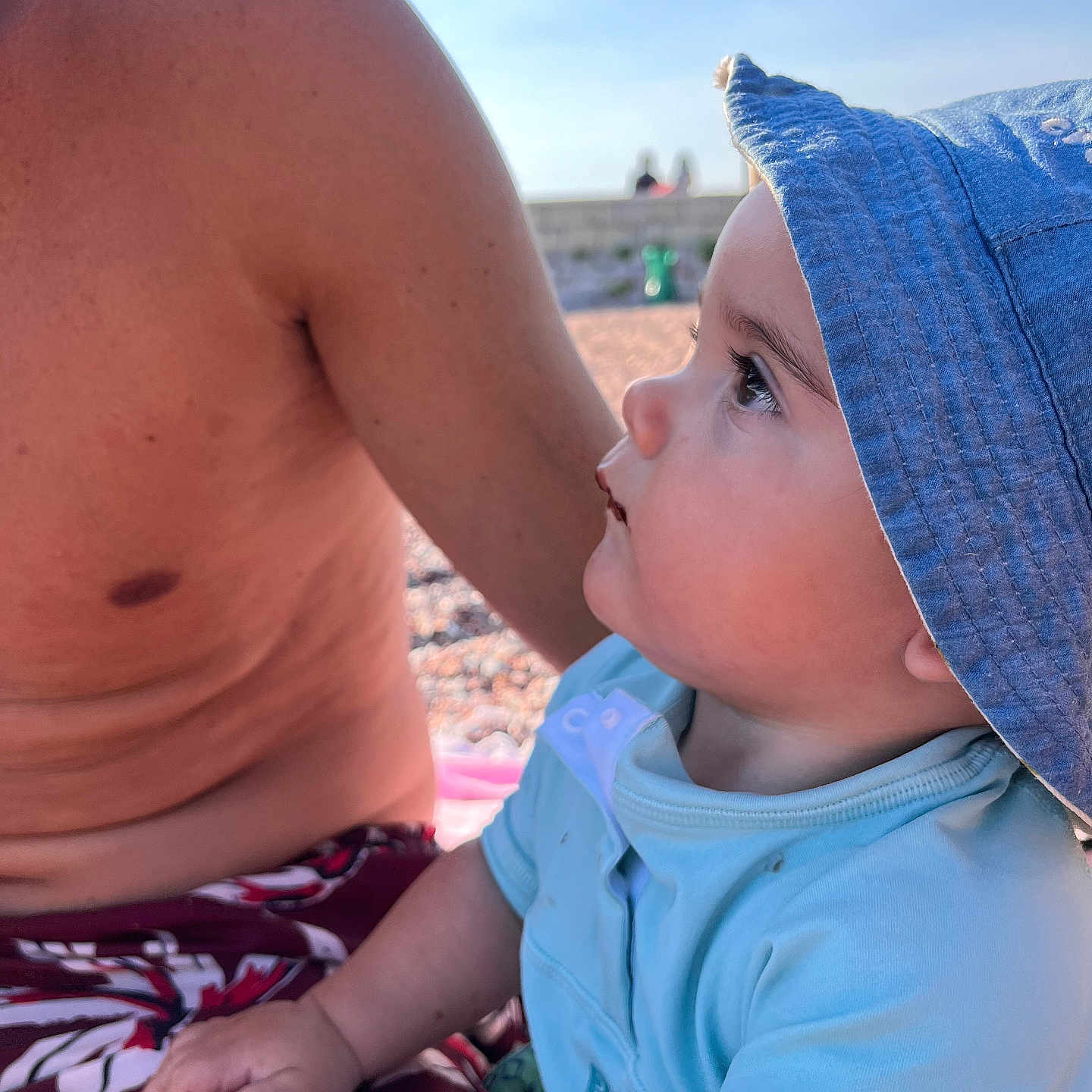 Lenny participe au concours pour gagner de l'argent avec cette photo : baby, baseballcap, bodypart, cap, clothing, face, finger, hand, hat, head, outdoors, person, photography, portrait, shorts, skin, summer, sunhat, swimwear, tattoo