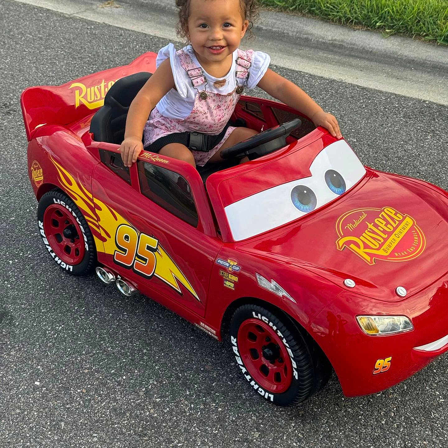 Amora is registered to the contest to win money with this photo: car, child, city, face, female, girl, grass, head, machine, outdoors, person, photography, plant, portrait, road, street, transportation, urban, vehicle, wheel