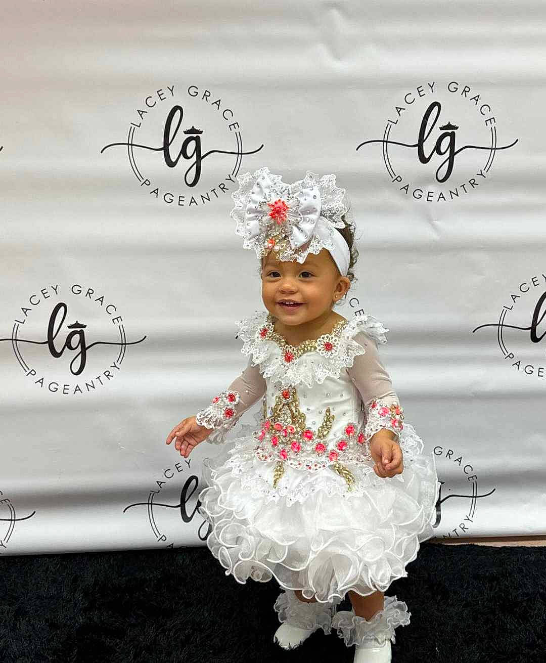 Amora joined the competition — help win amazing prizes! advertising, child, dress, event, fashion_accessory, fashion_design, fictional_character, flooring, font, gesture, happy, hat, headpiece, headwear, jewellery, joy, logo, necklace, person, photo_caption