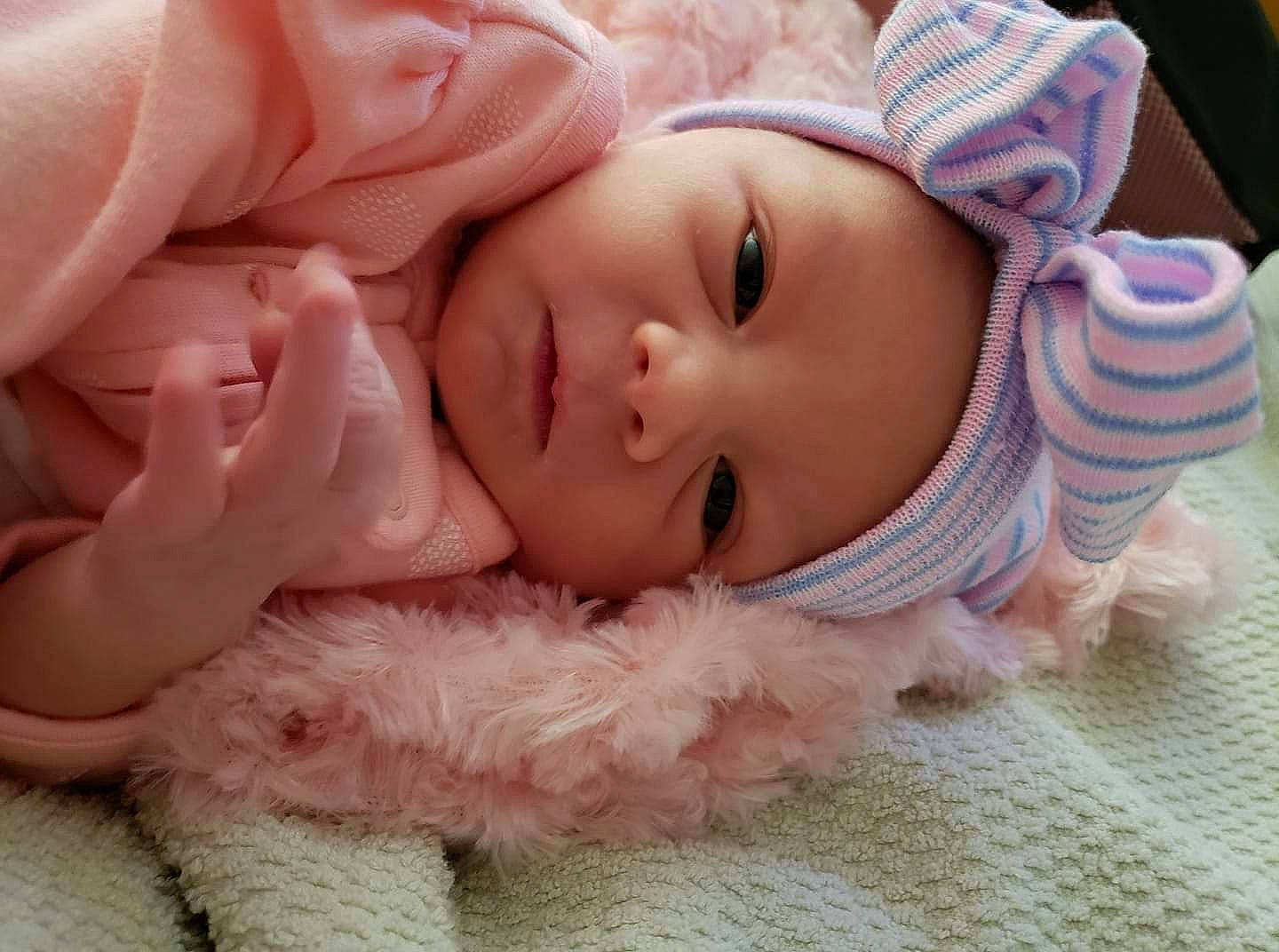 Skye joined the competition — help win amazing prizes! baby, baby_toddler_clothing, cheek, child, comfort, eye, eyebrow, eyelash, finger, gesture, happy, headgear, headwear, iris, lip, mouth, nose, person, pink, skin