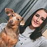 Peanut joined the competition — help win amazing prizes! brown_dog, casual_clothing, companion, couch, cozy, curtains, dog, ear_up, friendly, happy, home, human, indoor, long_hair, looking_at_camera, pet, portrait, seated, smiling, woman