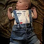 Caiden joined the competition — help win amazing prizes! baby, infant, denim, shorts, suspenders, blanket, fuzzy, clothing, portrait, cute, child, toddler, laying_down, indoors, face, expression, skin, head, person, casual