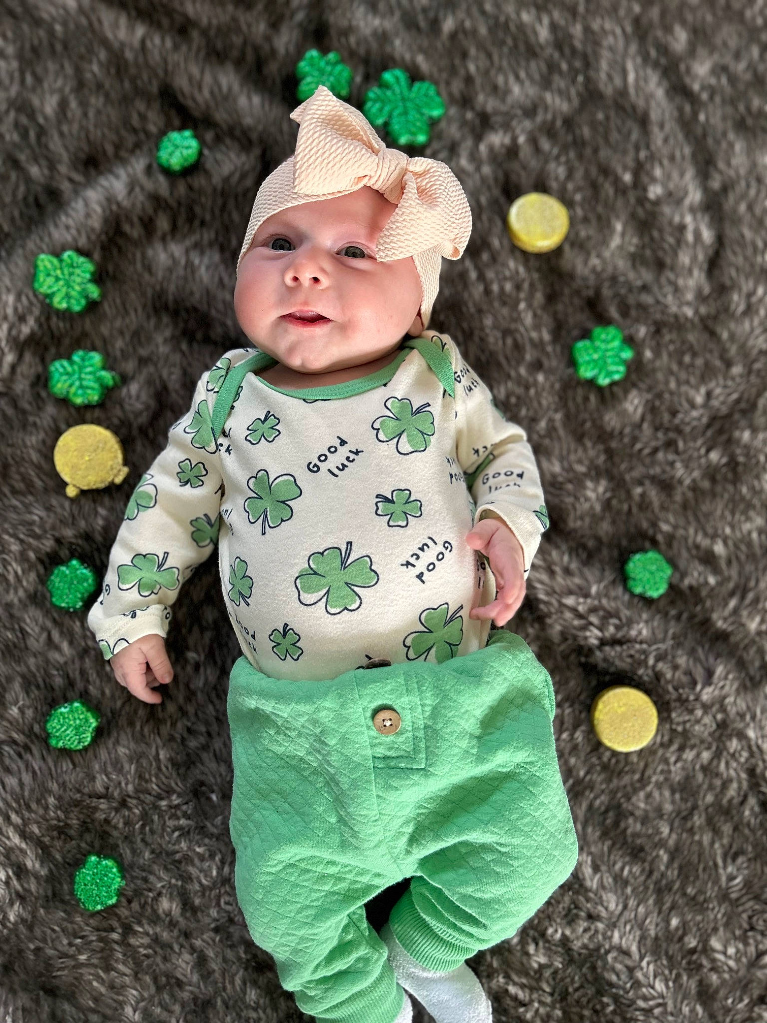 Madison is registered to the contest to win money with this photo: baby, baby_toddler_clothing, cap, child, costume_hat, grass, green, happy, head, headwear, human, outerwear, pattern, people_in_nature, person, skin, sleeve, standing, t_shirt, textile