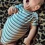 Seth joined the competition — help win amazing prizes! baby, blanket, child, comfort, cute, face, foot, hand, head, indoors, infant, leopard_print, lying_down, onesie, skin, sleepy, soft_texture, striped_clothing, yawning, young