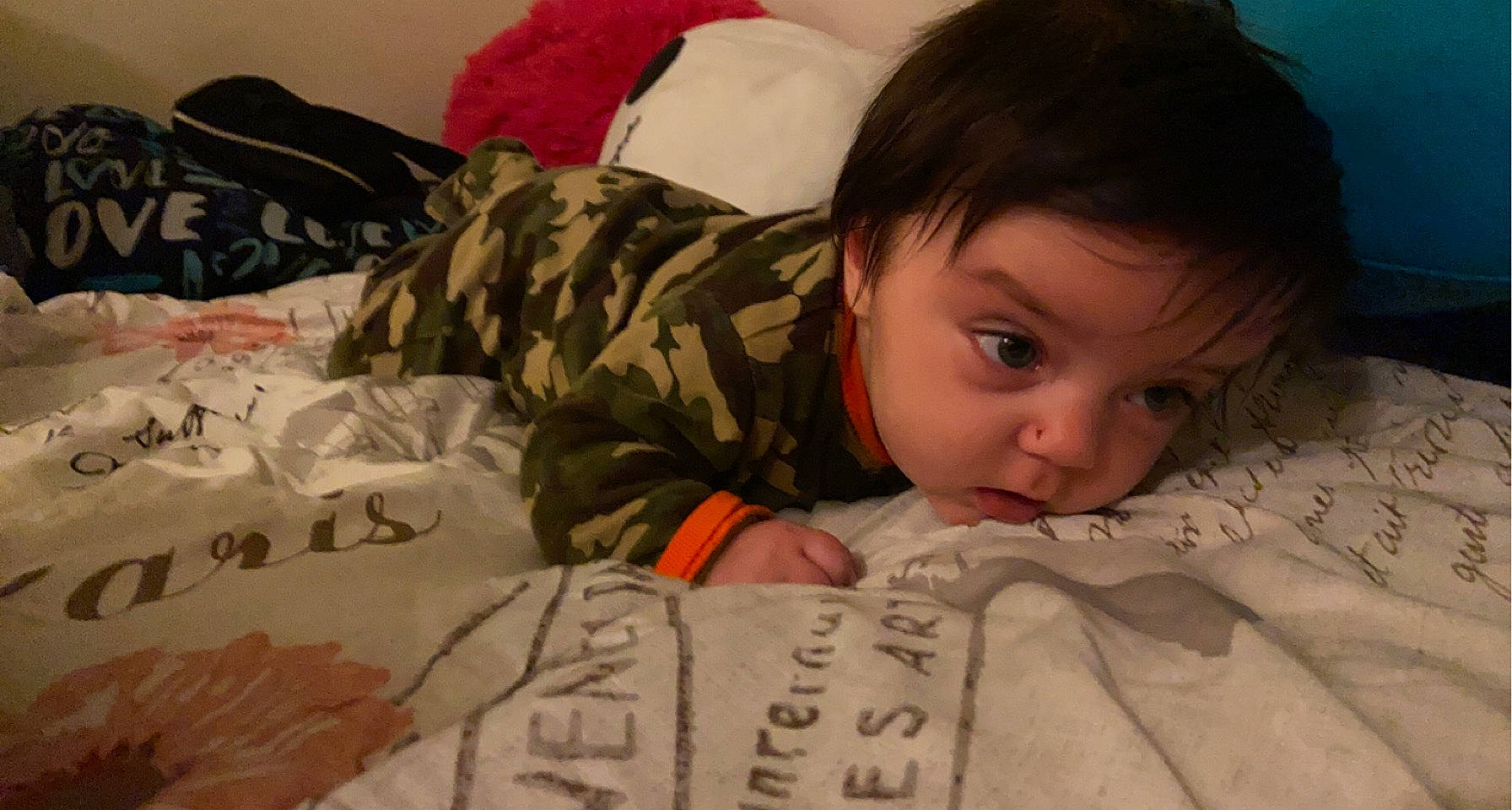 Nolan Joshua Hayes is registered to the contest to win money with this photo: baby, bedtime, cheek, child, chin, comfort, face, facial_expression, finger, flooring, head, human, linens, mouth, nose, person, skin, sleeve, textile, toddler