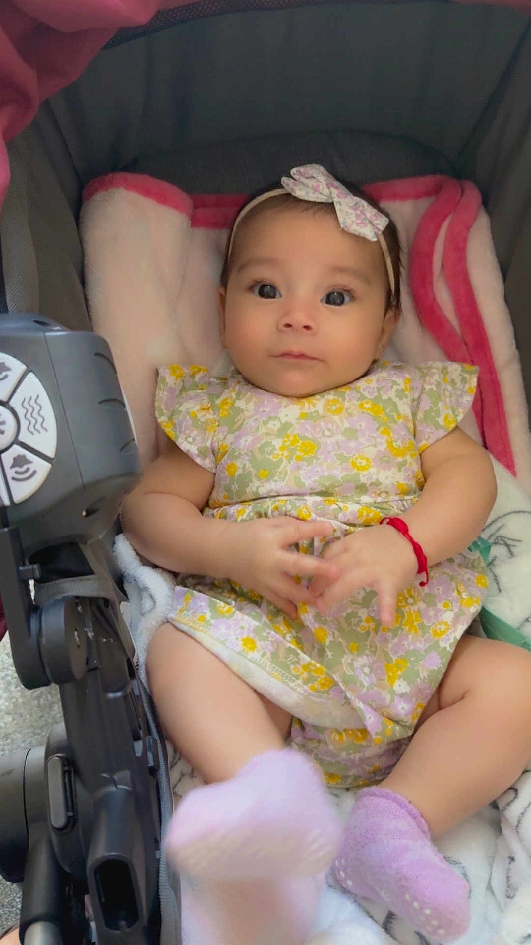 Sophia joined the competition — help win amazing prizes! baby, child, infant, stroller, dress, headband, socks, blanket, hands, face, person, cute, pink, purple, floral, footwear, seated, indoor, soft, adorable