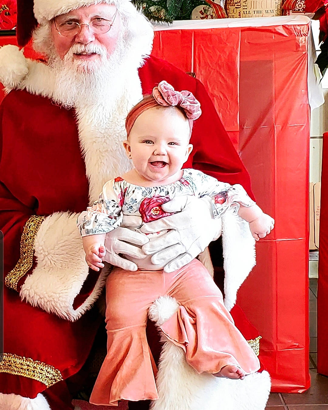 Laney is registered to the contest to win money with this photo: beard, child, christmas, christmas_eve, daughter, facial_hair, fictional_character, fur, grandparent, happy, holiday, joy, lap, person, red, santa_claus, sitting, smile, toddler