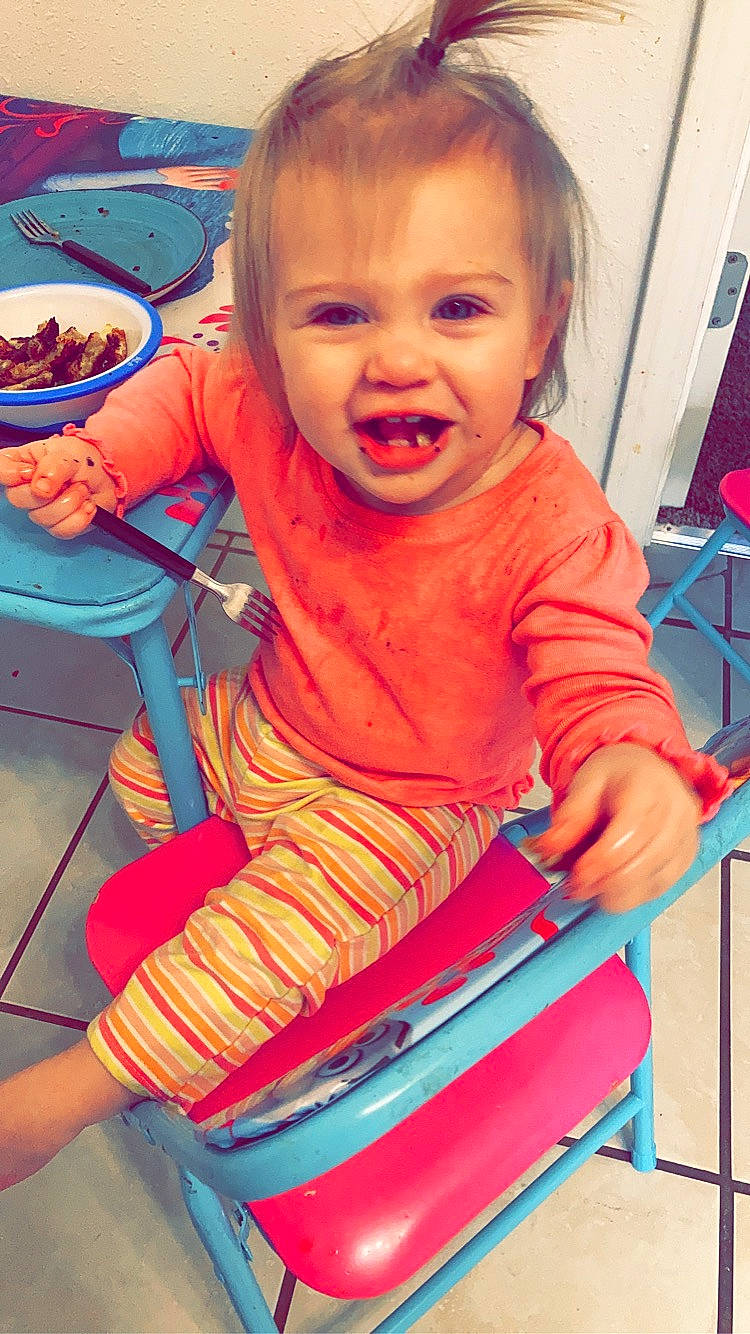 Jerzey is registered to the contest to win money with this photo: baby, baby_toddler_clothing, chair, cheek, child, electric_blue, face, finger, fun, happy, leisure, nose, orange, organ, person, play, sitting, skin, smile, standing