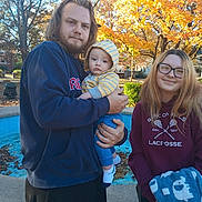 Cooper joined the competition — help win amazing prizes! baby, child, man, woman, family, hoodie, glasses, blanket, fall, autumn, outdoor, trees, leaves, park, smile, casual_clothing, portrait, daylight, holding, people