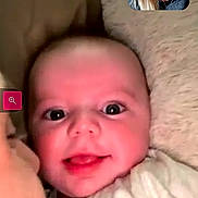 Asher joined the competition — help win amazing prizes! baby, infant, smiling, face, adult, cuddle, blanket, video_call, woman, portrait, indoor, happy, close_up, communication, technology, family, love, skin, person, head