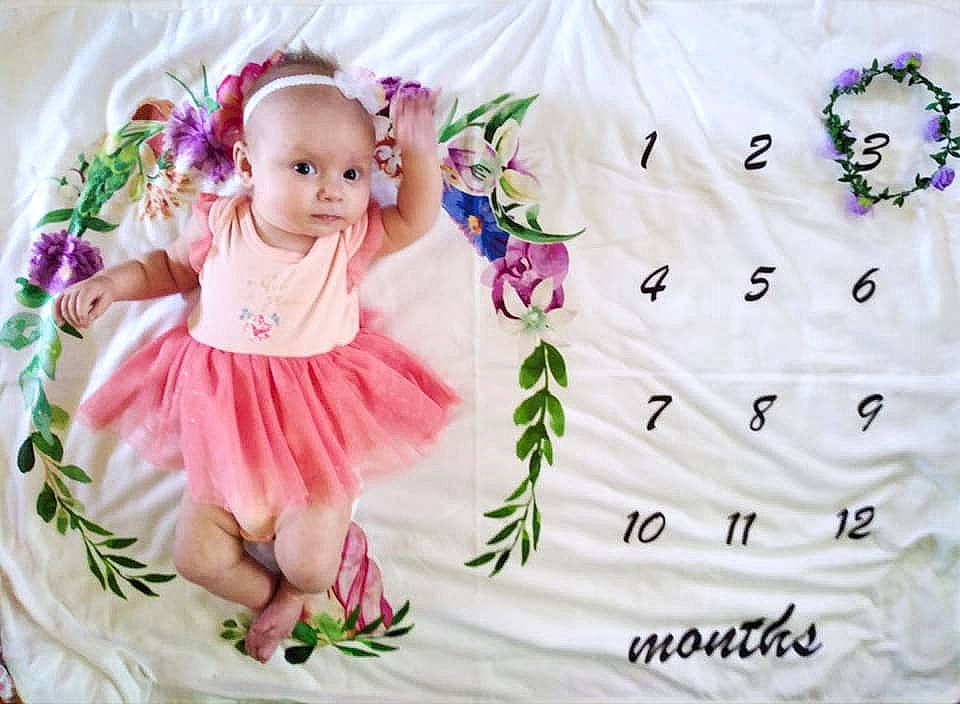 Lyla joined the competition — help win amazing prizes! baby, baby_products, baby_toddler_clothing, creative_arts, cut_flowers, doll, embellishment, fictional_character, lavender, linens, mythical_creature, person, petal, pink, purple, ruffle, violet