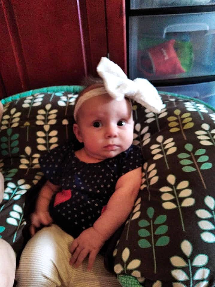 Lyla is registered to the contest to win money with this photo: baby, baby_toddler_clothing, ear, eye, living_room, nose, pattern, person, polka_dot, toddler