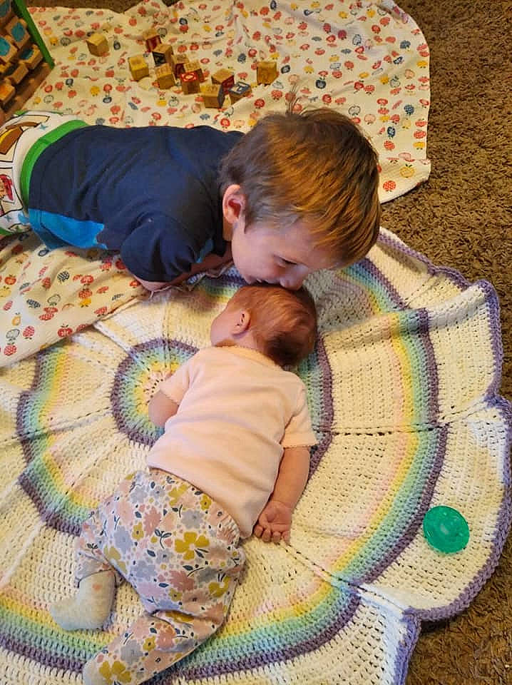 Brayton is registered to the contest to win money with this photo: baby, baby_products, baby_toddler_clothing, bed_sheet, bedding, bedtime, child, comfort, creative_arts, ear, home_accessories, human, interaction, linens, love, nap, pattern, person, sleep, textile