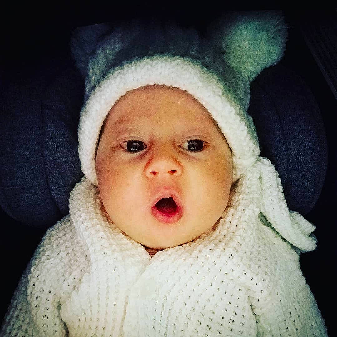 Carly is registered to the contest to win money with this photo: baby, baby_laughing, baby_making_funny_faces, baby_sleeping, cheek, child, ear, eye, face, facial_expression, hat, head, headgear, headwear, lip, mouth, nose, person, skin, smile