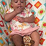 Nora joined the competition — help win amazing prizes! baby, child, clothing, colorful, cushion, cute, feet, fingers, giraffe, head, indoors, infant, legs, onesie, pattern, plush_toy, portrait, relaxed, sleepy, soft_toy