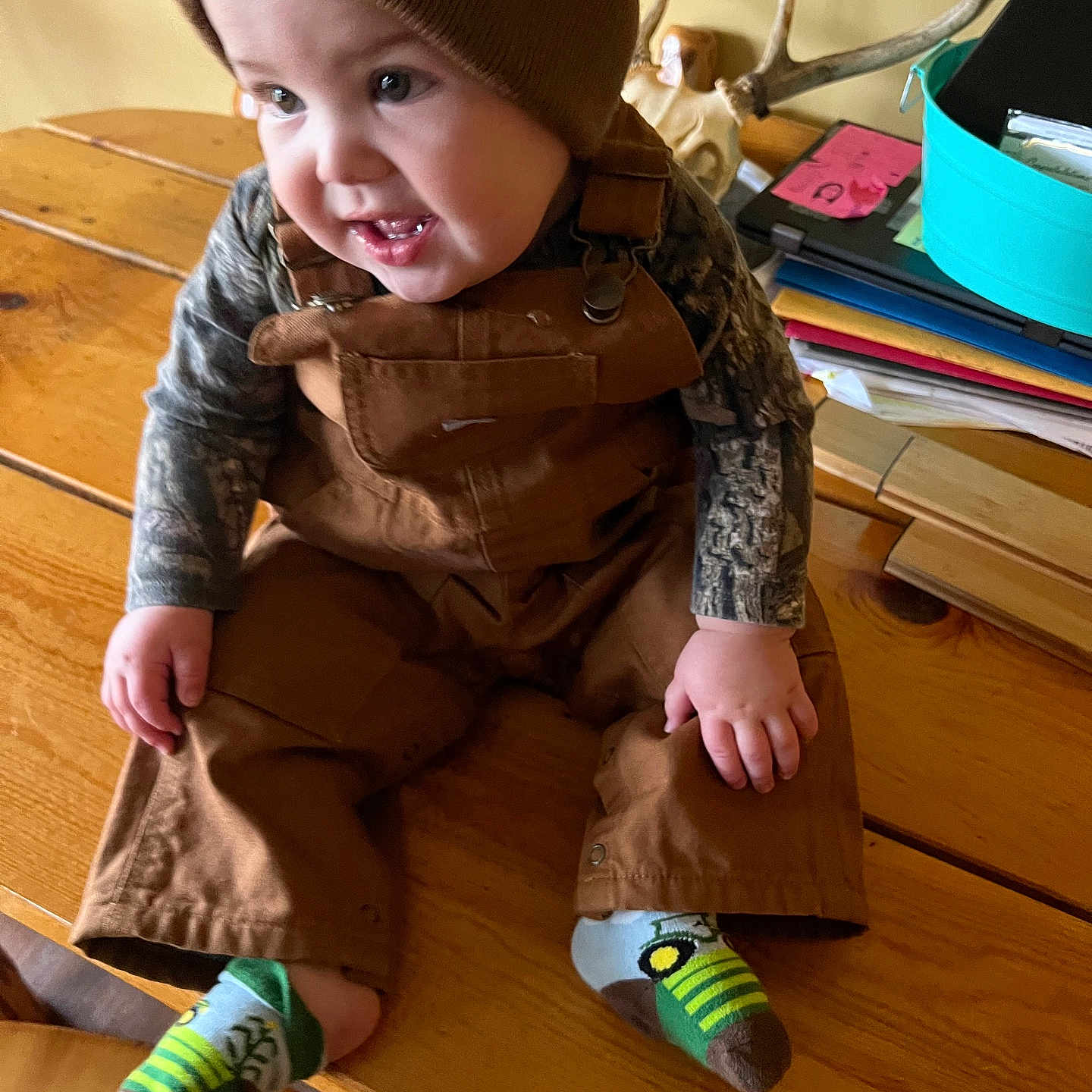 Owen is registered to the contest to win money with this photo: baby, bodypart, cap, clothing, face, finger, footwear, hand, hardwood, hat, head, hosiery, pants, person, photography, plywood, portrait, shoe, sock, wood