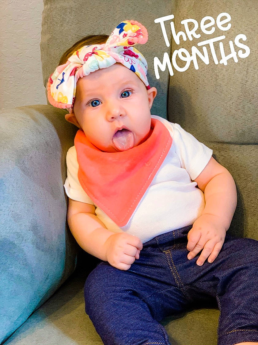 Emma Rose is registered to the contest to win money with this photo: baby, baby_products, baby_toddler_clothing, cap, child, child_model, ear, fashion_accessory, hair_accessory, headband, headgear, headwear, person, sitting, sleeve, surprise, toddler