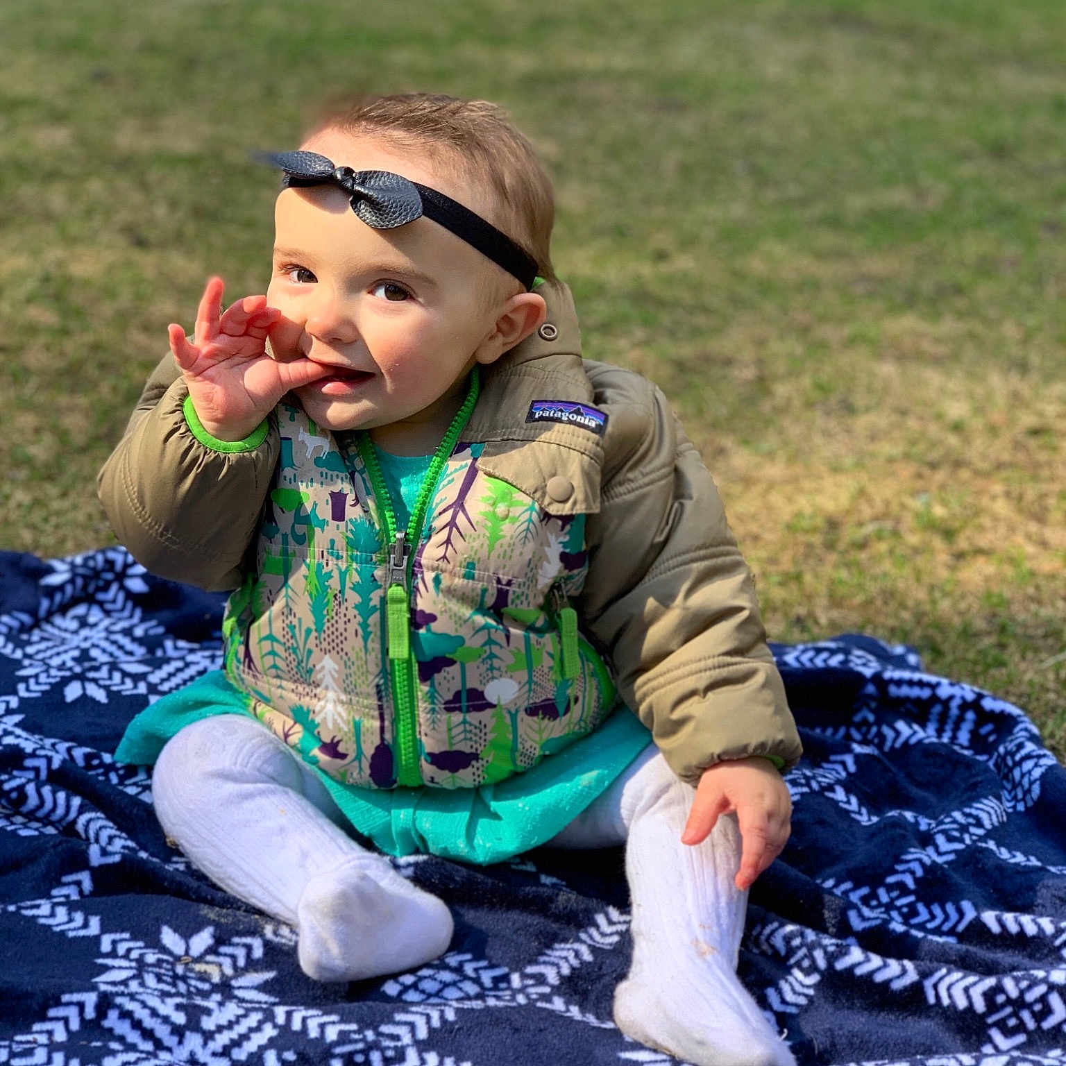 Dally is registered to the contest to win money with this photo: adaptation, baby, cheek, child, fun, grass, green, headwear, joy, lawn, leaf, pattern, people, person, plant, play, sitting, smile, toddler, vacation