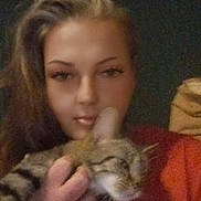 Annabelle joined the competition — help win amazing prizes! animal, blurred, casual, cat, cozy, face, feline, hair, hand, holding, indoor, person, pet, picture_frame, portrait, red_clothing, relaxed, tabby_cat, wall, warm_lighting